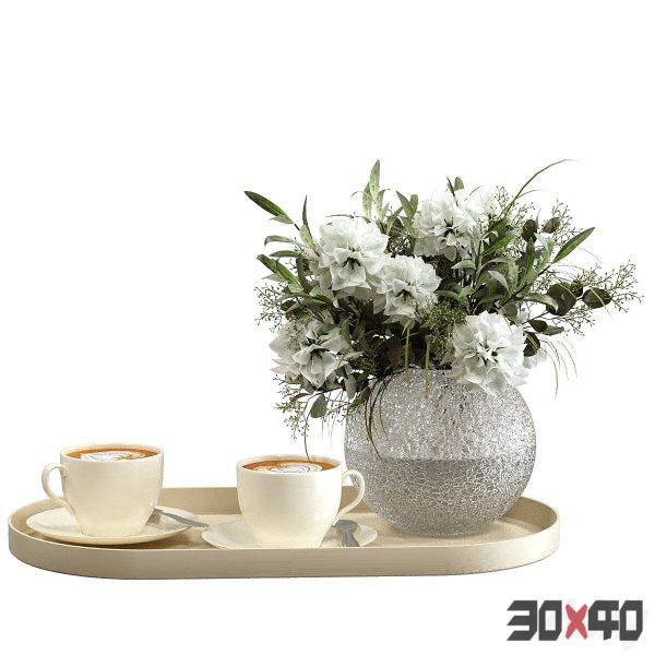 Coffee on a tray with a bouquet of flowers